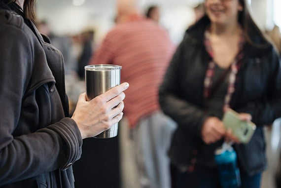 Holding Coffee